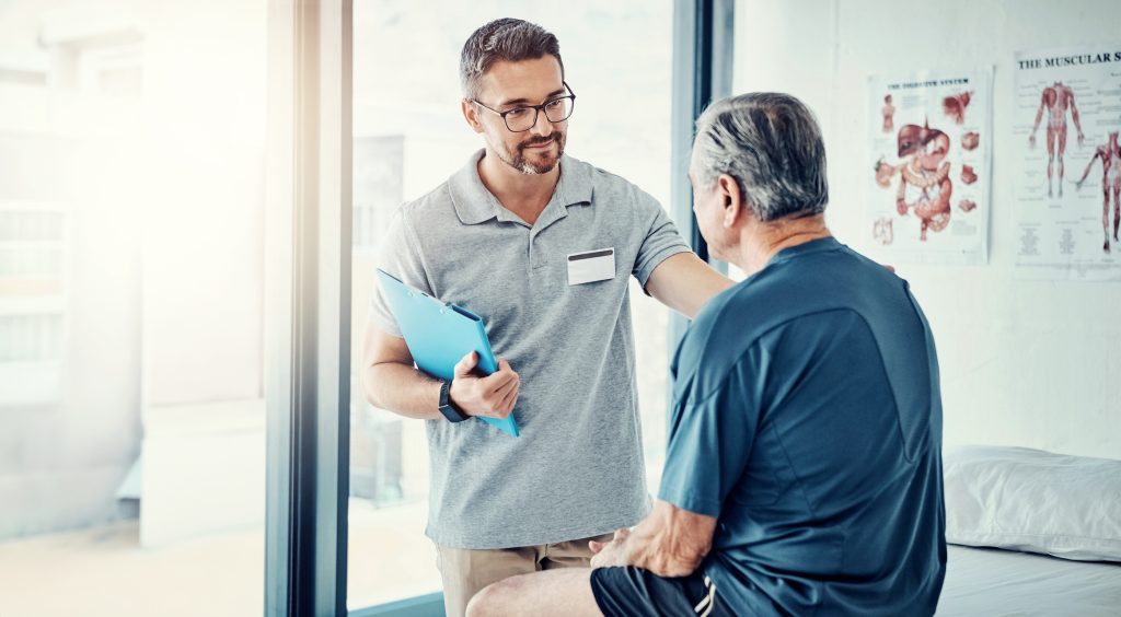 Washington state chiropractor talking to a patient about care. 